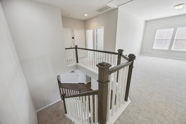stairs featuring carpet flooring, baseboards, and recessed lighting