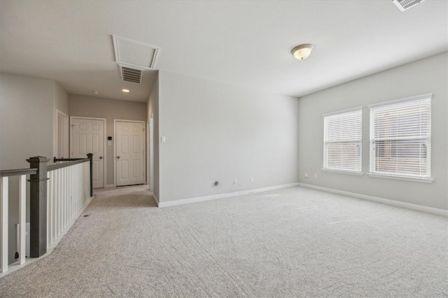 1716 Elaina Loop, Leander, TX 78641 - empty room with attic access, light colored carpet, baseboards, and recessed lighting