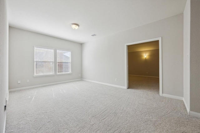 1716 Elaina Loop, Leander, TX 78641 - carpeted empty room featuring baseboards
