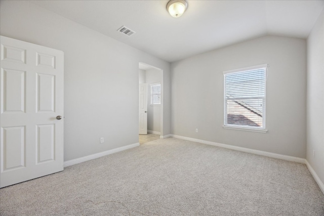 1716 Elaina Loop, Leander, TX 78641 - unfurnished bedroom featuring carpet, baseboards, and lofted ceiling