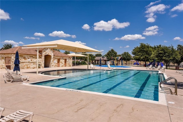 1716 Elaina Loop, Leander, TX 78641 - community pool with a patio