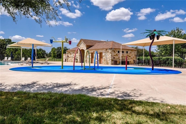 view of property's community with fence and a swimming pool