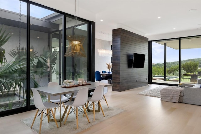4202 Serene Hills Dr, Austin, TX 78738 - dining space with floor to ceiling windows, wood finished floors, and recessed lighting