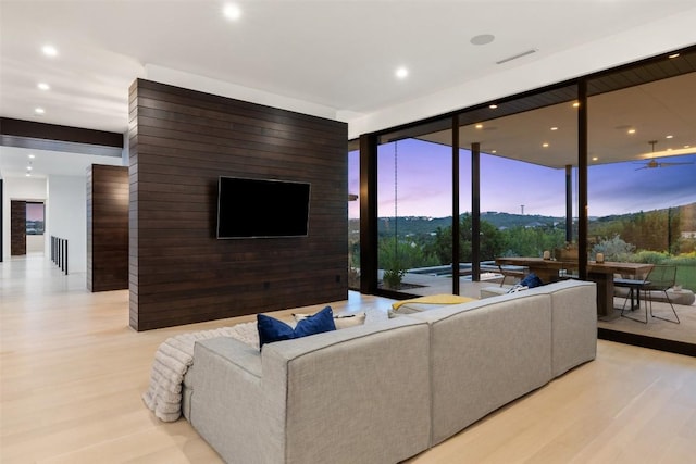 4202 Serene Hills Dr, Austin, TX 78738 - living room featuring a wall of windows, wood finished floors, recessed lighting, and a ceiling fan