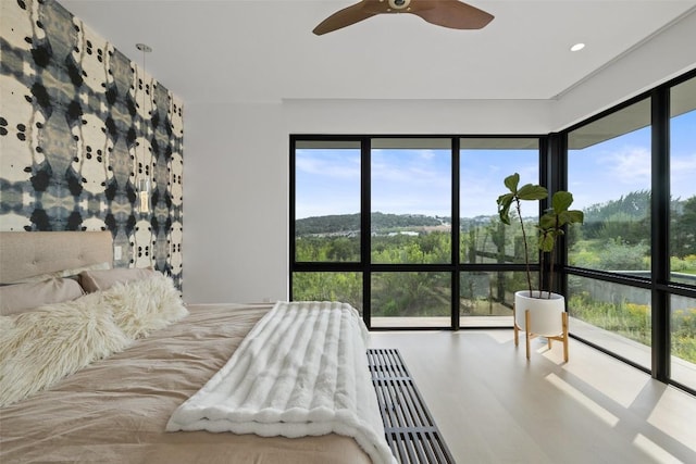 4202 Serene Hills Dr, Austin, TX 78738 - bedroom with multiple windows, ceiling fan, and recessed lighting