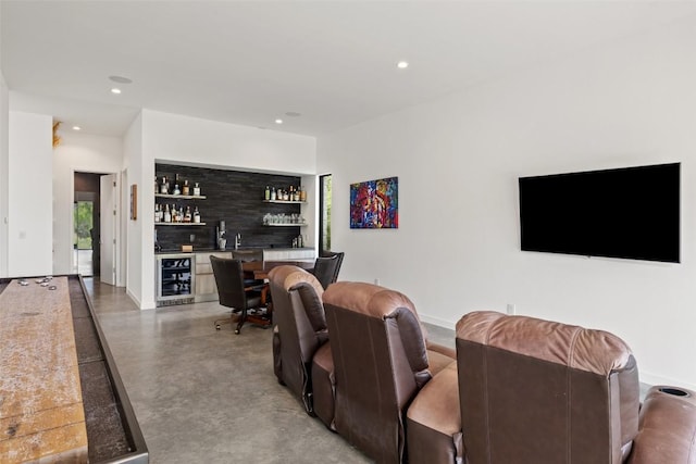 4202 Serene Hills Dr, Austin, TX 78738 - living room featuring beverage cooler, wet bar, finished concrete floors, and recessed lighting