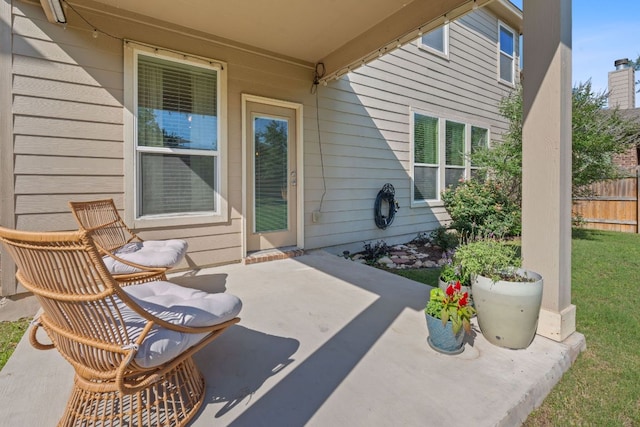 view of patio featuring fence