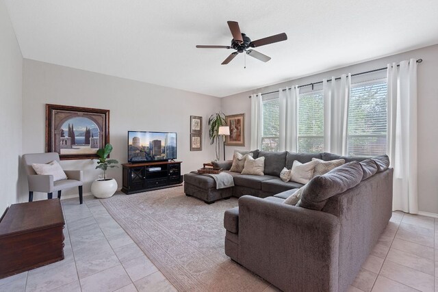 living room featuring light tile patterned flooring and a ceiling fan