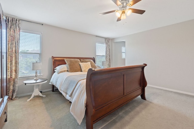 476 Sheepshank Dr, Georgetown, TX 78633 - bedroom with multiple windows, light carpet, and baseboards