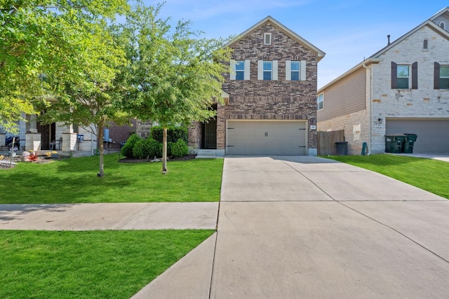 view of front of house with driveway, an attached garage, a front lawn, and brick siding
