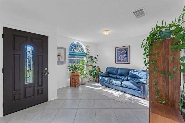 302 Debora Dr, Georgetown, TX 78628 - entrance foyer with light tile patterned flooring and baseboards