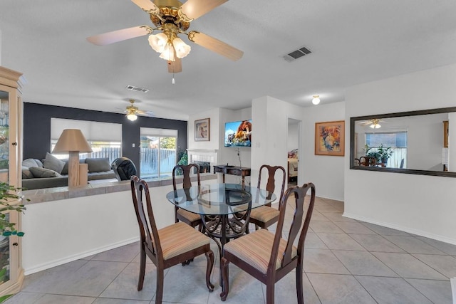 302 Debora Dr, Georgetown, TX 78628 - dining space featuring tile patterned floors, a ceiling fan, and baseboards