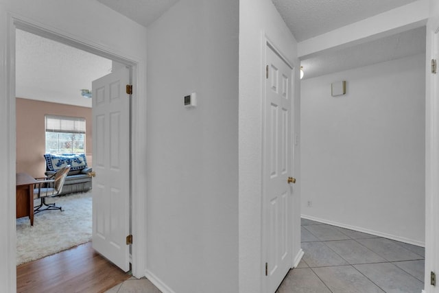 302 Debora Dr, Georgetown, TX 78628 - corridor with a textured ceiling and baseboards