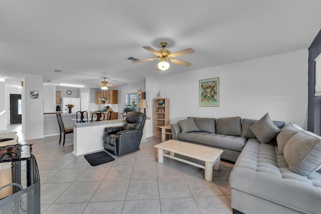 302 Debora Dr, Georgetown, TX 78628 - living room with light tile patterned floors and ceiling fan