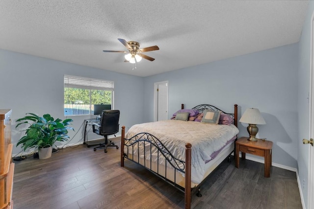 302 Debora Dr, Georgetown, TX 78628 - bedroom featuring wood finished floors, ceiling fan, baseboards, a textured ceiling, and a desk