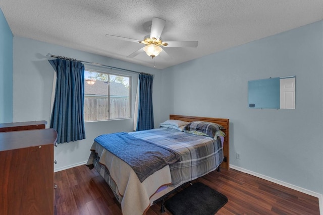 302 Debora Dr, Georgetown, TX 78628 - bedroom with wood finished floors, baseboards, a textured ceiling, and a ceiling fan