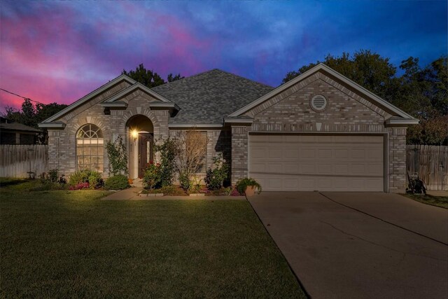 302 Debora Dr, Georgetown, TX 78628 - view of front of property featuring concrete driveway, a garage, brick siding, and stone siding