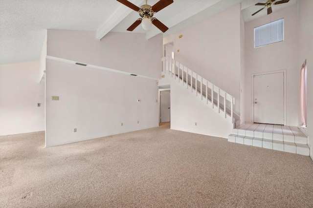 1046 Verbena Dr Unit 1474, Austin, TX 78750 - unfurnished living room featuring ceiling fan, carpet floors, high vaulted ceiling, and beam ceiling