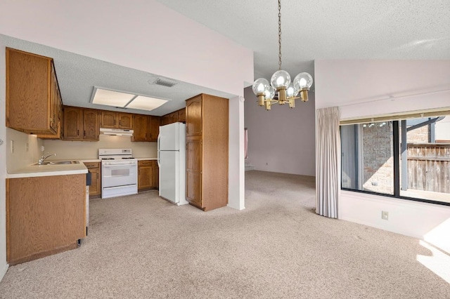 1046 Verbena Dr Unit 1474, Austin, TX 78750 - kitchen featuring white appliances, under cabinet range hood, light colored carpet, vaulted ceiling, and a chandelier