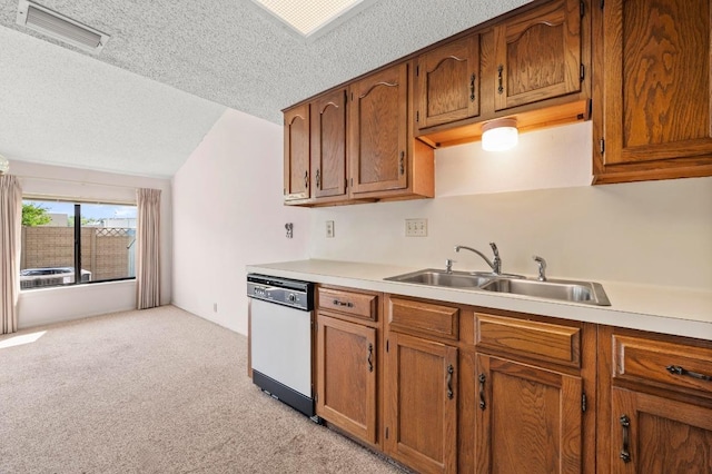 1046 Verbena Dr Unit 1474, Austin, TX 78750 - kitchen with dishwasher, a sink, light colored carpet, a textured ceiling, and vaulted ceiling