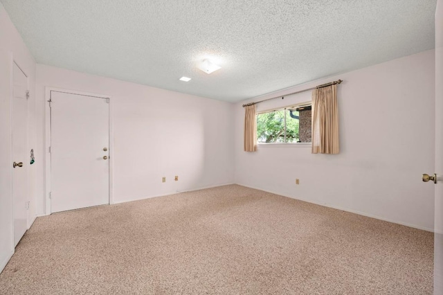1046 Verbena Dr Unit 1474, Austin, TX 78750 - carpeted empty room featuring a textured ceiling