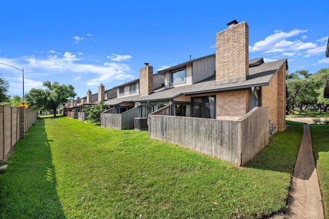 1046 Verbena Dr Unit 1474, Austin, TX 78750 - back of house featuring a chimney, central air condition unit, and brick siding