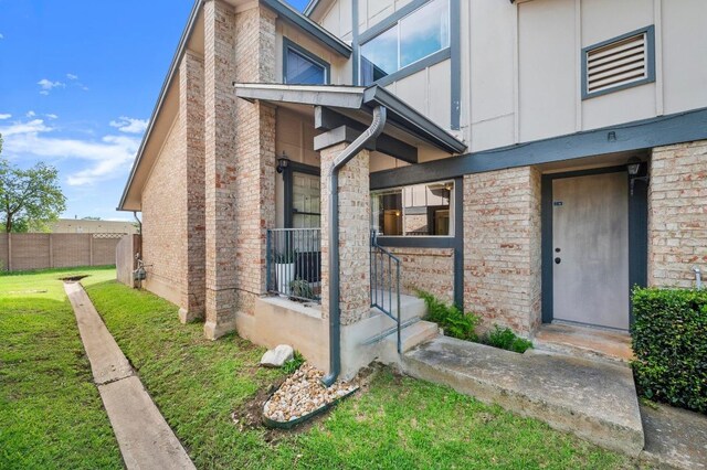 1046 Verbena Dr Unit 1474, Austin, TX 78750 - entrance to property with brick siding