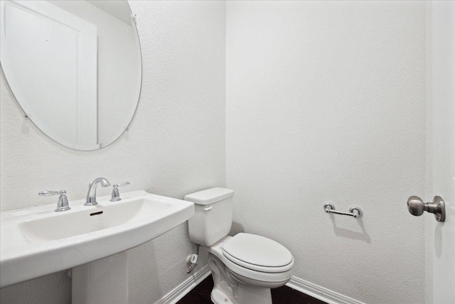 208 Carolina Jasmine Dr, San Marcos, TX 78666 - half bath featuring toilet, baseboards, and a sink