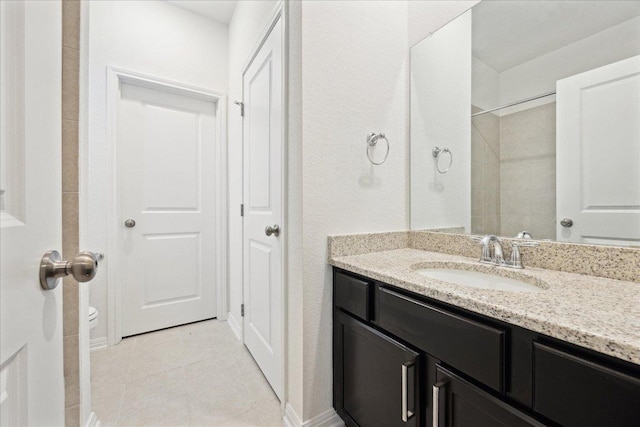 208 Carolina Jasmine Dr, San Marcos, TX 78666 - bathroom featuring vanity, tile patterned flooring, and toilet