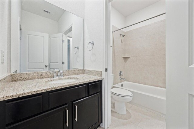 208 Carolina Jasmine Dr, San Marcos, TX 78666 - full bath with toilet, vanity, tile patterned floors, and shower / tub combination
