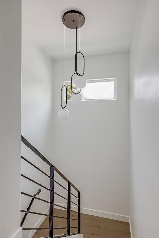 1809 Pasadena Dr, Austin, TX 78757 - stairs featuring wood finished floors and baseboards