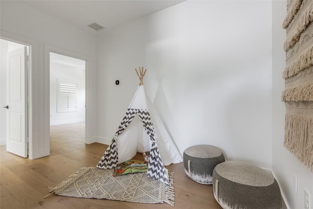 1809 Pasadena Dr, Austin, TX 78757 - recreation room featuring wood finished floors and baseboards
