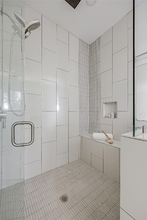 1809 Pasadena Dr, Austin, TX 78757 - full bath with a shower stall, tile patterned floors, and tile walls
