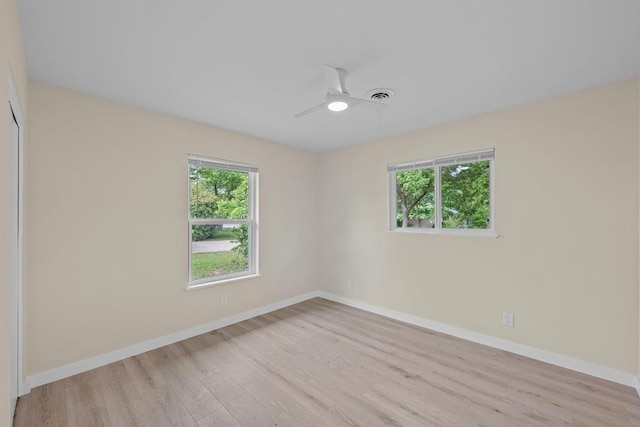 8507 Parkfield Dr, Austin, TX 78758 - unfurnished room featuring light wood-type flooring, a ceiling fan, and baseboards