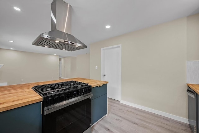 8507 Parkfield Dr, Austin, TX 78758 - kitchen with wood counters, gas range oven, ventilation hood, light wood-type flooring, and stainless steel dishwasher