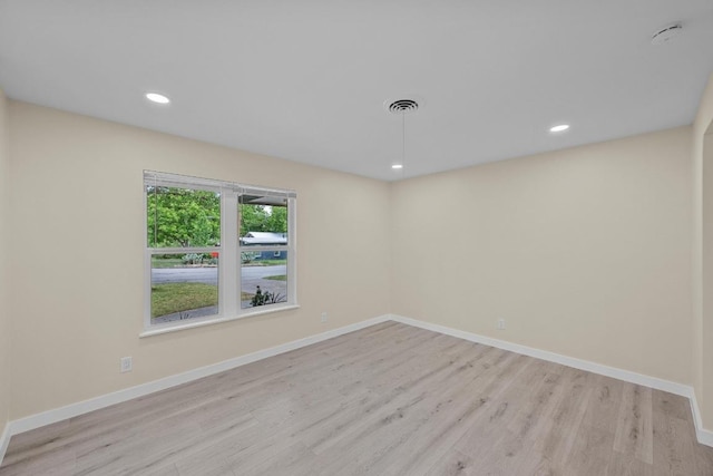 8507 Parkfield Dr, Austin, TX 78758 - empty room featuring light wood-style flooring, baseboards, recessed lighting, and a smoke detector