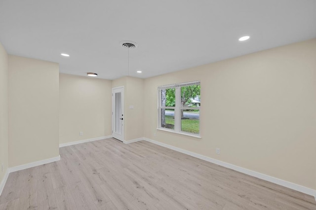 8507 Parkfield Dr, Austin, TX 78758 - spare room featuring wood finished floors, recessed lighting, and baseboards