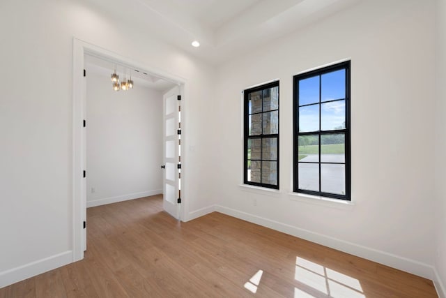 310 Apache Tears, Horseshoe Bay, TX 78657 - empty room featuring baseboards, light wood-style floors, recessed lighting, and a chandelier
