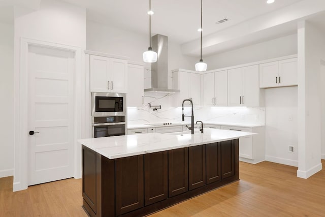310 Apache Tears, Horseshoe Bay, TX 78657 - kitchen featuring oven, wall chimney exhaust hood, tasteful backsplash, light wood-style flooring, and recessed lighting