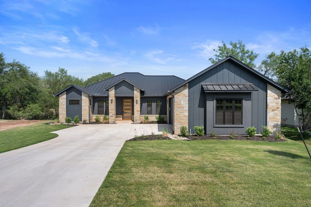 310 Apache Tears, Horseshoe Bay, TX 78657 - view of front of property with stone siding, a standing seam roof, concrete driveway, and board and batten siding
