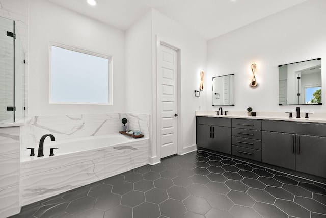 3417 Prairie Heights Dr, Leander, TX 78641 - full bath with double vanity, a bath, tile patterned floors, a shower stall, and recessed lighting