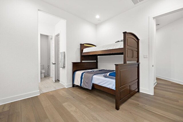 3417 Prairie Heights Dr, Leander, TX 78641 - bedroom with wood finished floors, baseboards, recessed lighting, and ensuite bath