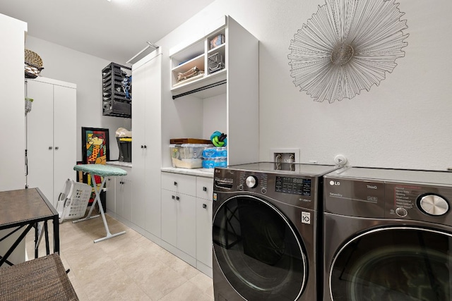 3417 Prairie Heights Dr, Leander, TX 78641 - clothes washing area with washing machine and clothes dryer and cabinet space