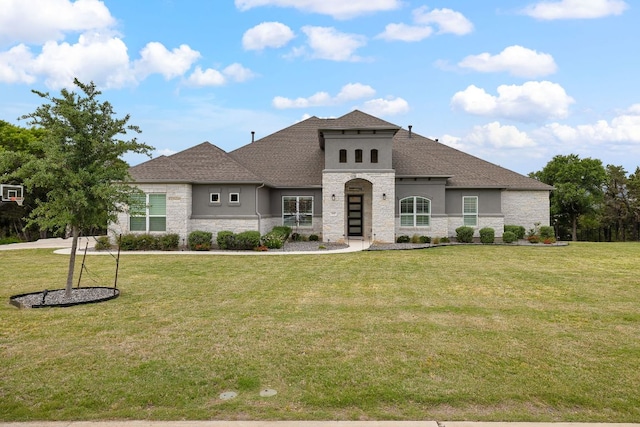 3417 Prairie Heights Dr, Leander, TX 78641 - french country inspired facade with stone siding, stucco siding, a front yard, and roof with shingles