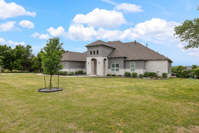 3417 Prairie Heights Dr, Leander, TX 78641 - french country home featuring stone siding, a front lawn, and stucco siding