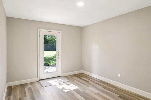 302 Martin Luther King St, Georgetown, TX 78626 - empty room with light wood finished floors and recessed lighting