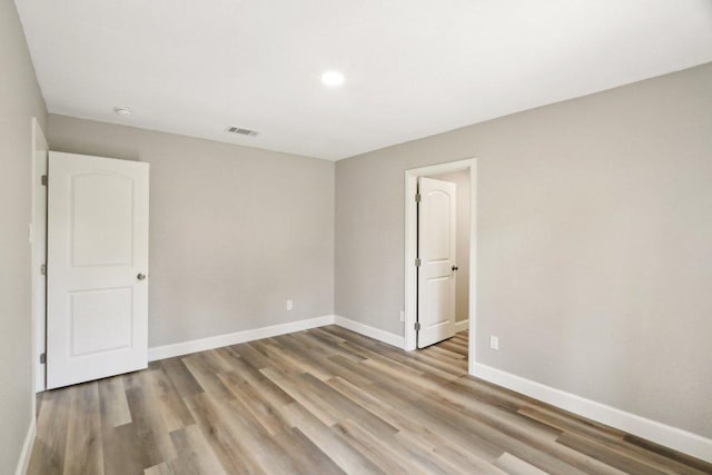 302 Martin Luther King St, Georgetown, TX 78626 - unfurnished room with wood finished floors and recessed lighting