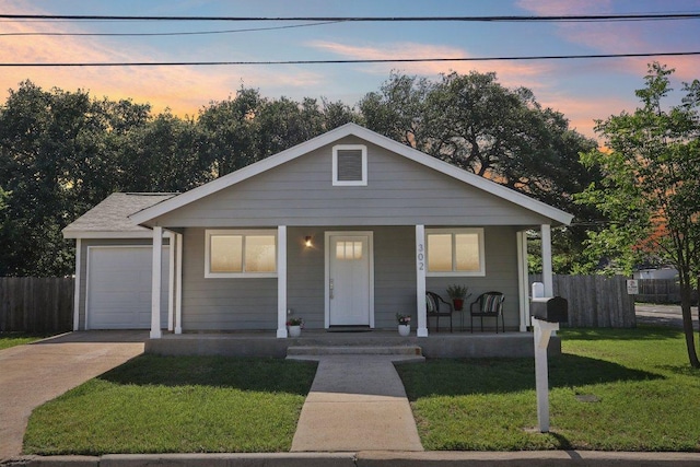 302 Martin Luther King St, Georgetown, TX 78626 - bungalow-style house featuring covered porch, concrete driveway, and an attached garage