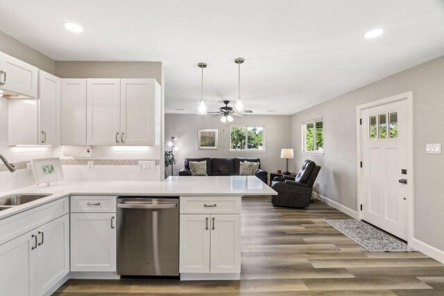 302 Martin Luther King St, Georgetown, TX 78626 - kitchen with stainless steel dishwasher, a ceiling fan, a peninsula, recessed lighting, and white cabinetry
