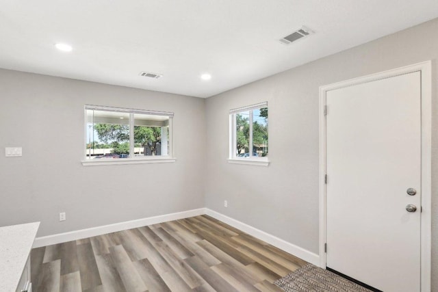 302 Martin Luther King St, Georgetown, TX 78626 - empty room with plenty of natural light, wood finished floors, baseboards, and recessed lighting